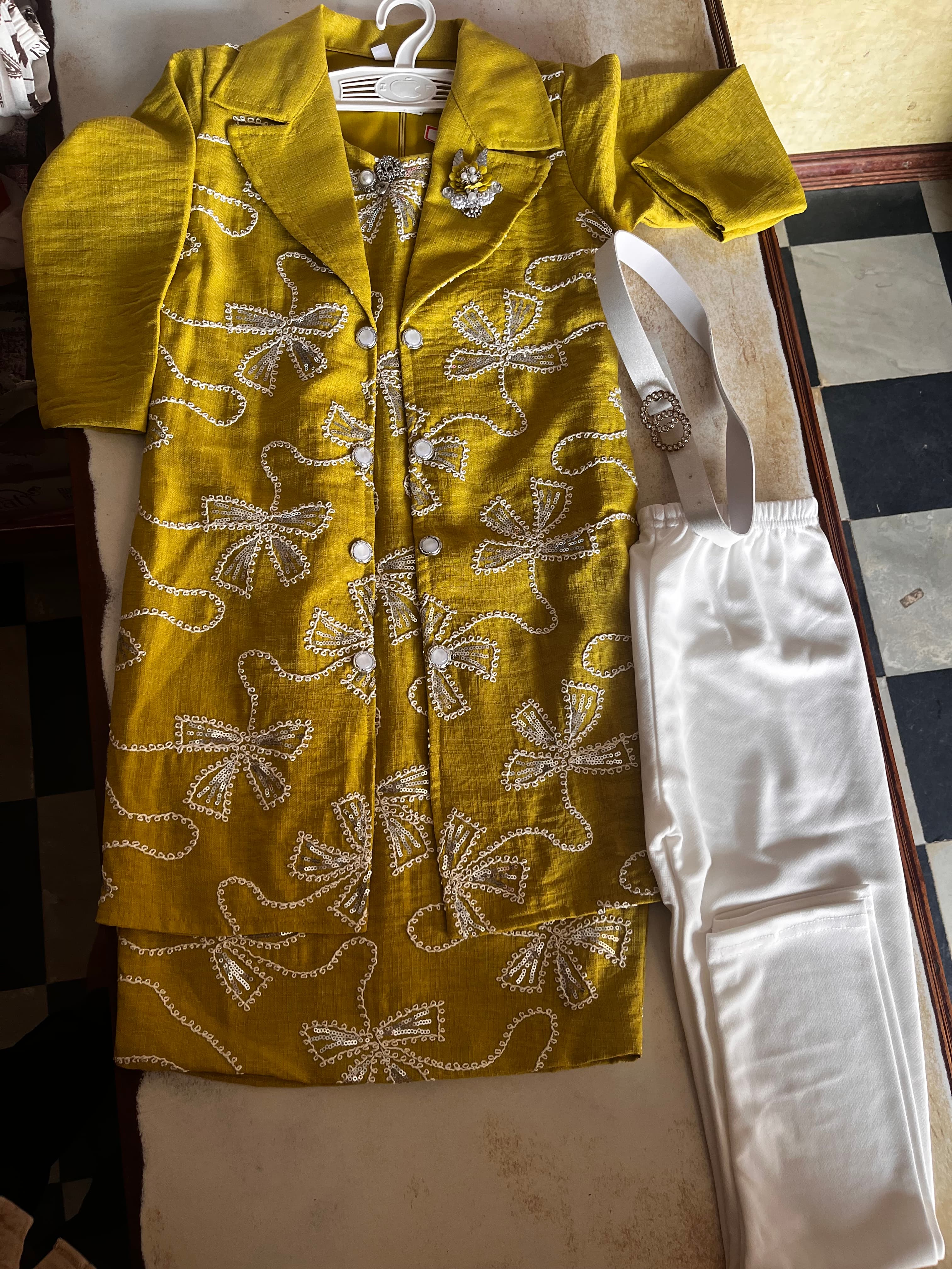 Mustard green air line frock with leggings and belt. — back